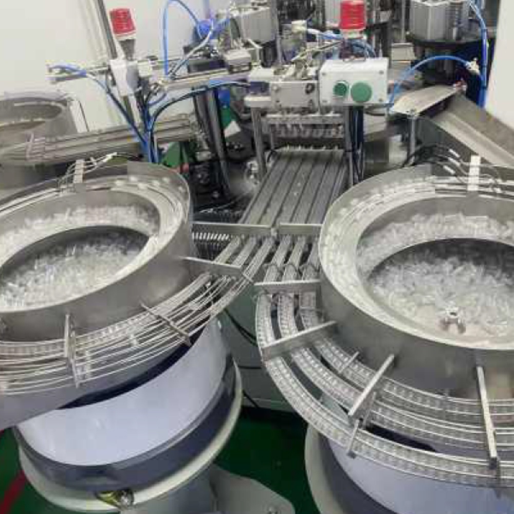 Heparin cap assembly machine